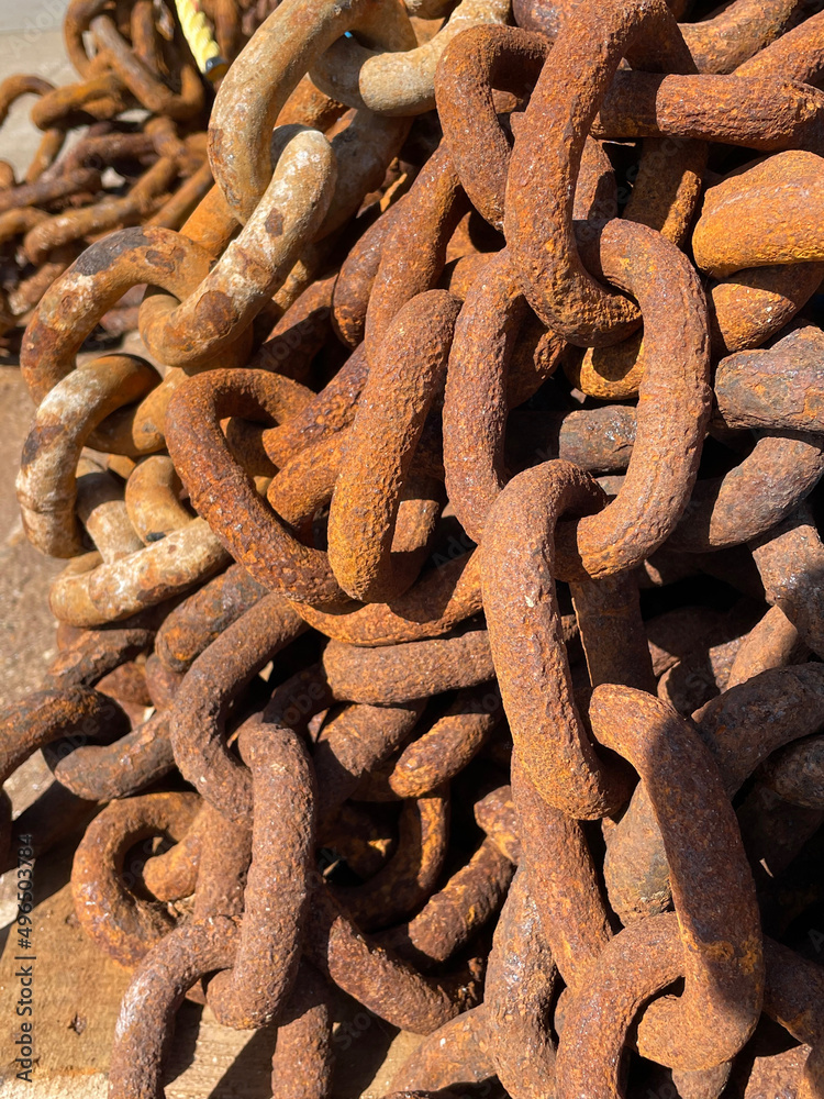 Large rusty metal chains on quayside Large rusty metal chains on quayside