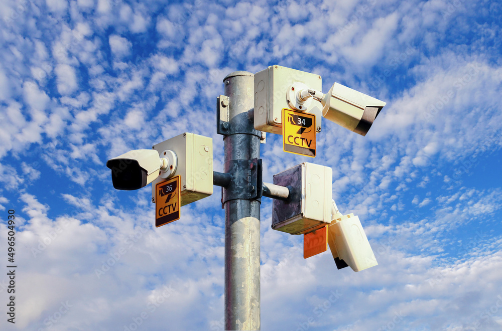 CCTV camera on bright blue sky background, Concept. 24 hour day and night security CCTV camera on bright blue sky background, Concept. 24 hour day and night security