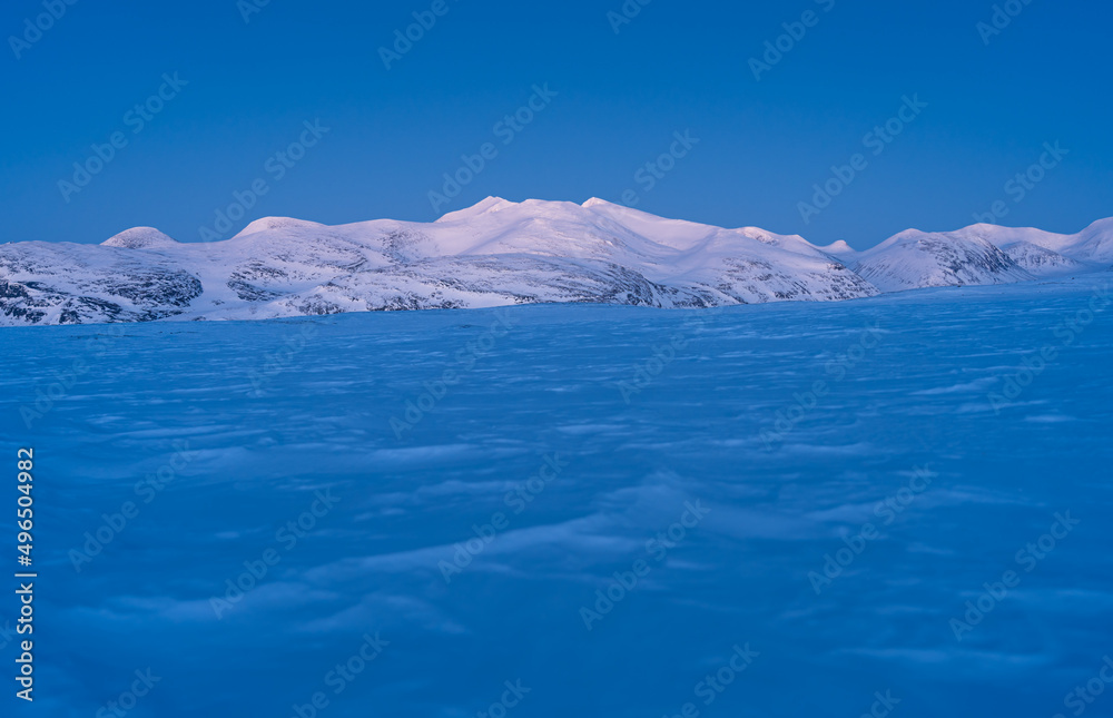 Dusk in the snow covered mountains in Swedish Lapland, near the famous Kungsleden.
