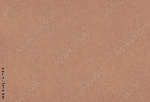 Close up view of textured brown coloured carton paper background. 
