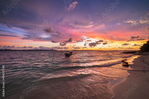Sunset colorful sky on sea, tropical desert beach, no people, dramatic clouds, travel destination getting away, long exposure Indonesia Sumatra Banyak Islands
