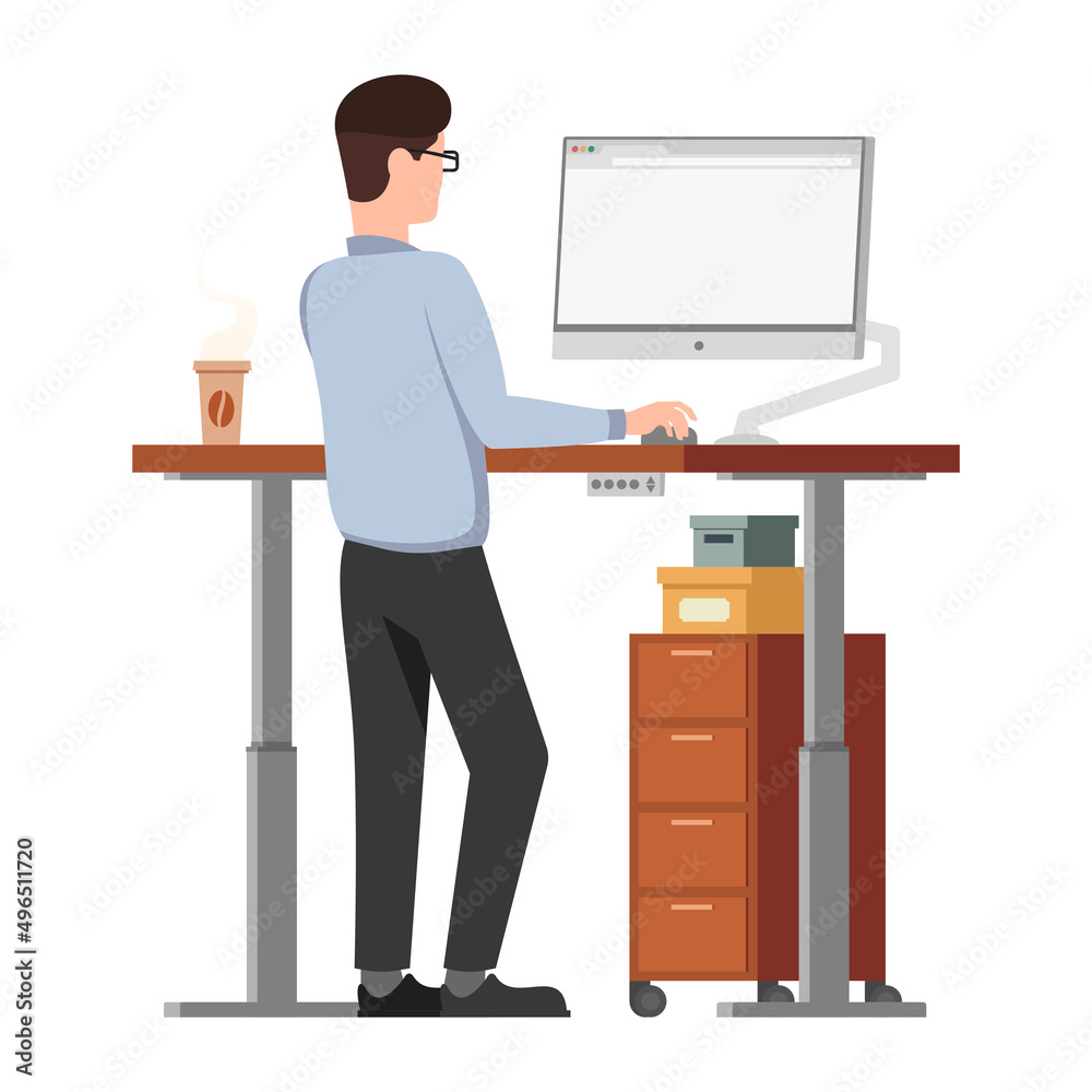 Male employee behind ergonomic adjustable sit and stand modern computer desk. Home or office comfort and modern workspace. 