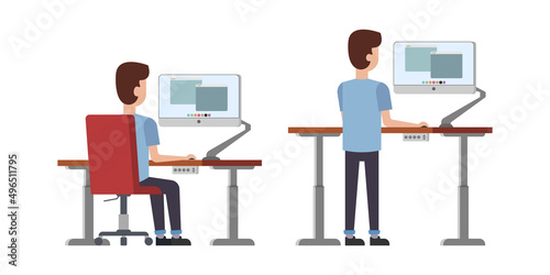 Male employee behind ergonomic adjustable sit and stand modern computer desk. Home or office comfort and modern workspace.  photo