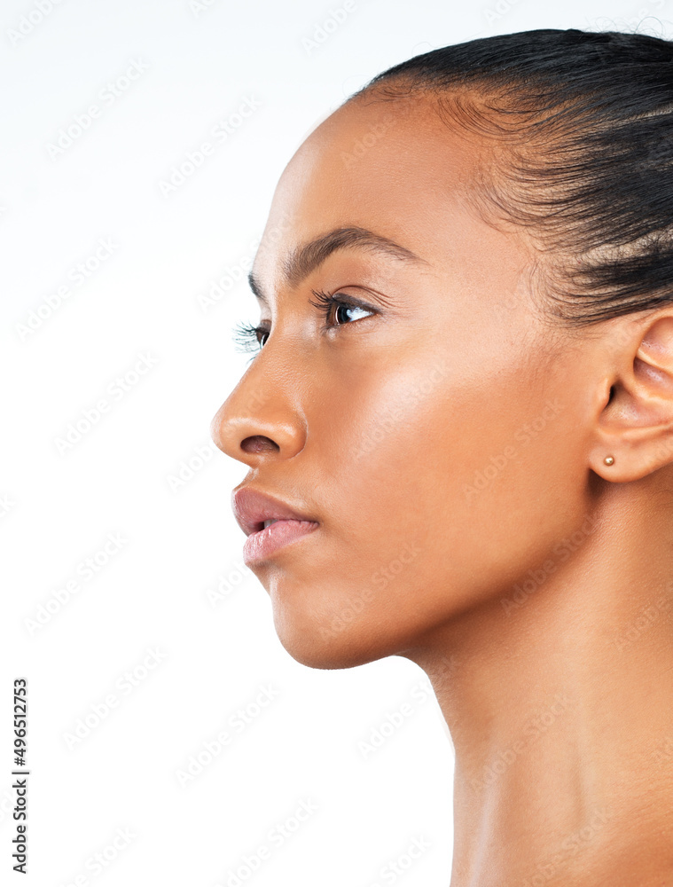 Looking into the distance. Studio shot of an attractive young woman posing against a white background. Looking into the distance. Studio shot of an attractive young woman posing against a white background.