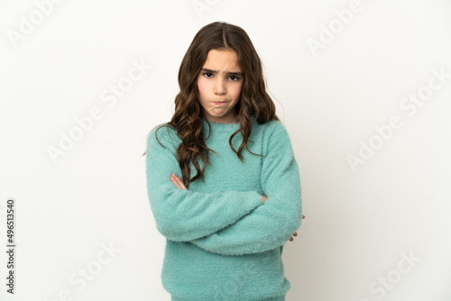 Little caucasian girl isolated on white background with unhappy expression © luismolinero