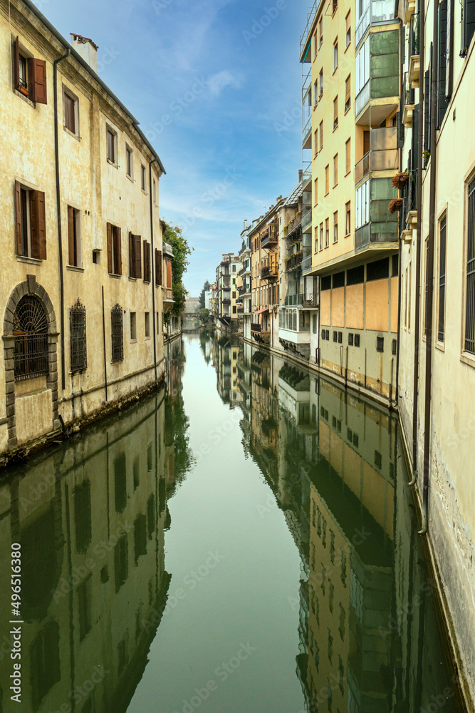 Beautiful canal with buildings reflecting in the water in the historic center of Padua Beautiful canal with buildings reflecting in the water in the historic center of Padua