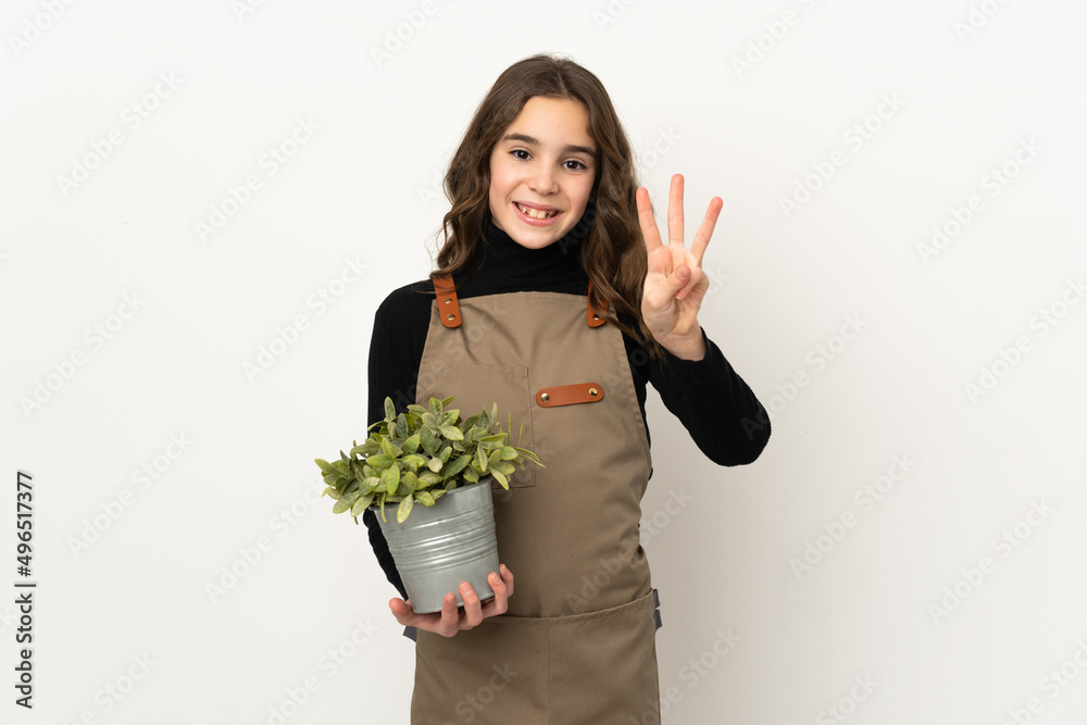 Little girl holding a plant isolated on white background happy and counting three with fingers Little girl holding a plant isolated on white background happy and counting three with fingers