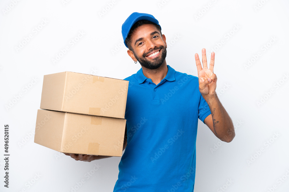 Delivery Brazilian man isolated on white background happy and counting three with fingers Delivery Brazilian man isolated on white background happy and counting three with fingers