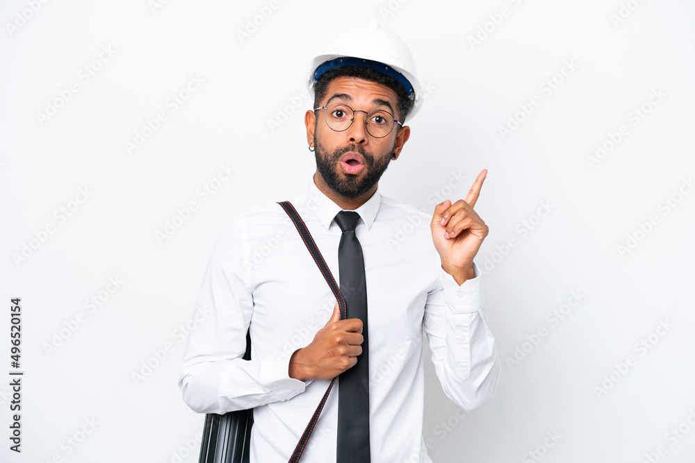 Young architect Brazilian man with helmet and holding blueprints isolated on white background intending to realizes the solution while lifting a finger up Young architect Brazilian man with helmet and holding blueprints isolated on white background intending to realizes the solution while lifting a finger up