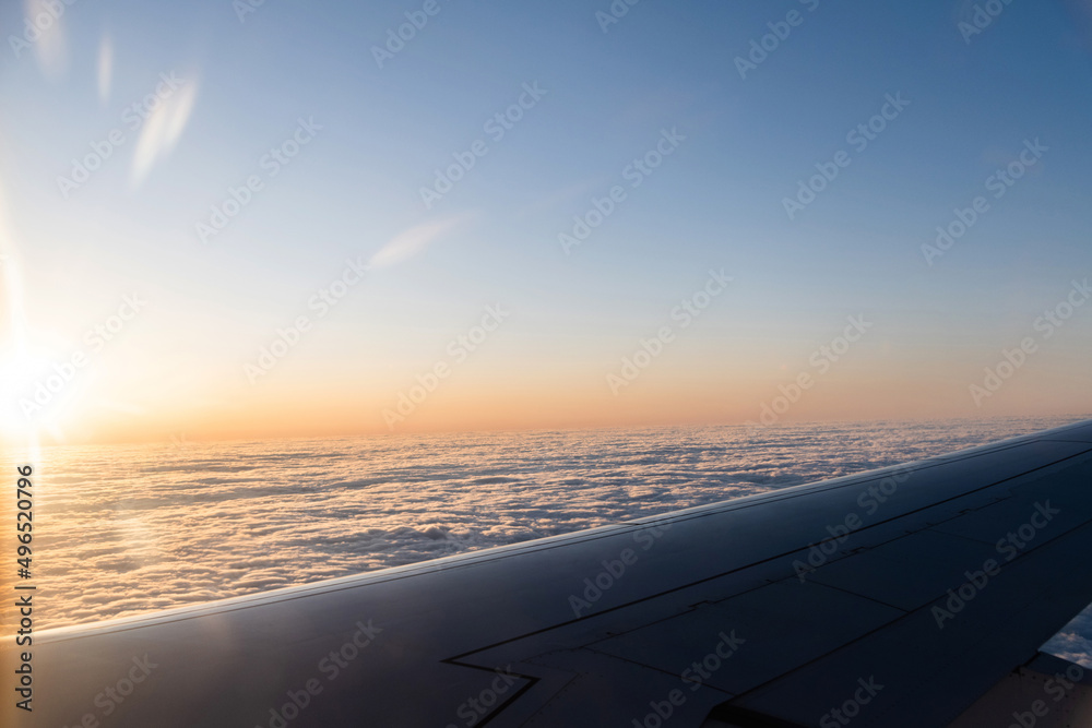 Looking at the sunset through the airplane window Looking at the sunset through the airplane window