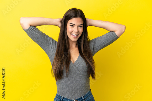 Young Brazilian woman isolated on yellow background laughing