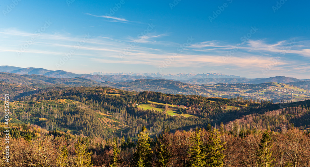 Nearer hills of Beskid mountains and Tatra mountains on the background from Cieslar hill in Beskid Slaski mountains on polish - czech borders