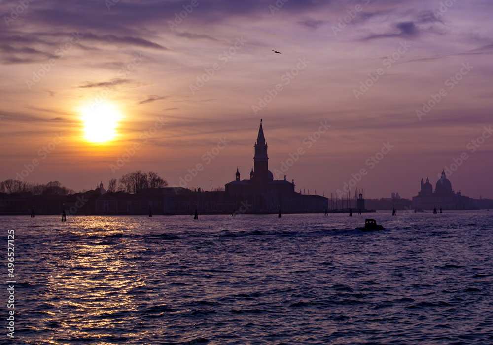 A shot of a sunset sky over silhouettes in Venice, Italy