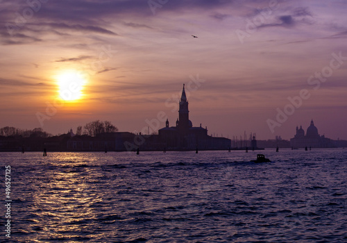 A shot of a sunset sky over silhouettes in Venice, Italy