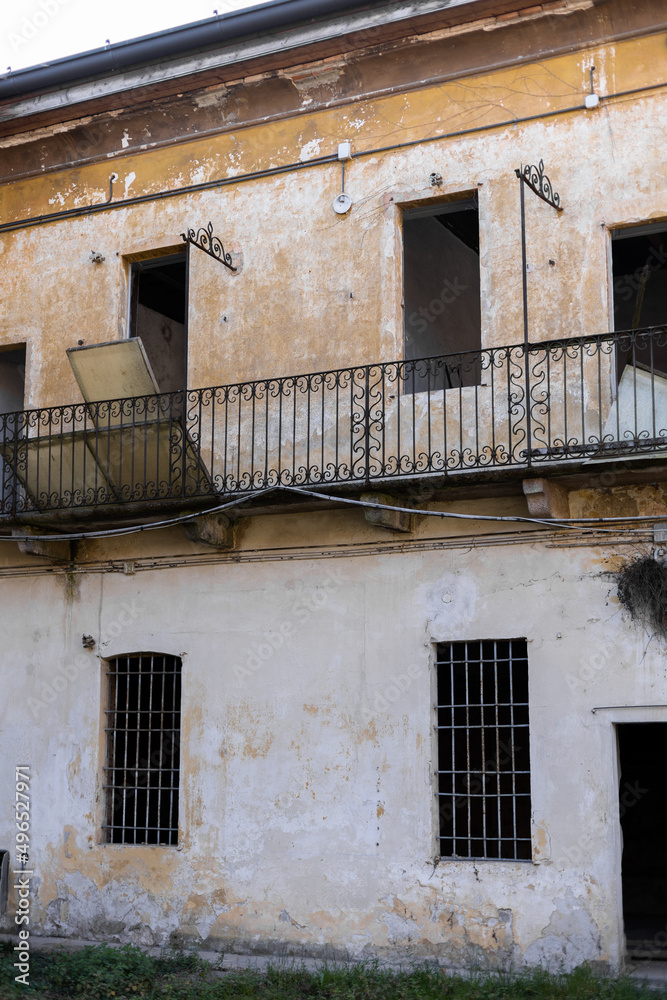 old door and windows in an old building without renovation