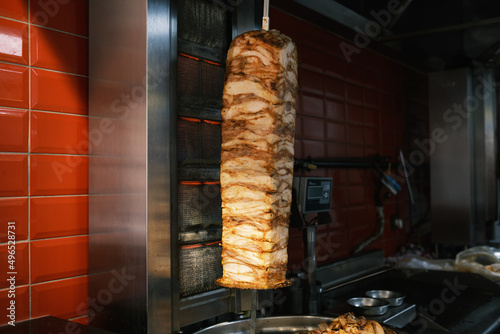 Traditional Turkish Doner Kebab meat. Shawarma or gyros. Turkish, greek or middle eastern arab style chicken doner kebab food in restaurant. Local names is "Döner"
