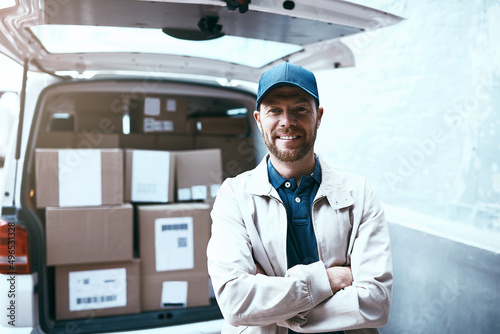 Wallpaper Mural All packed up and ready for delivery. Portrait of a cheerful young delivery man standing next to a van full of boxes with his arms folded outside during the day. Torontodigital.ca