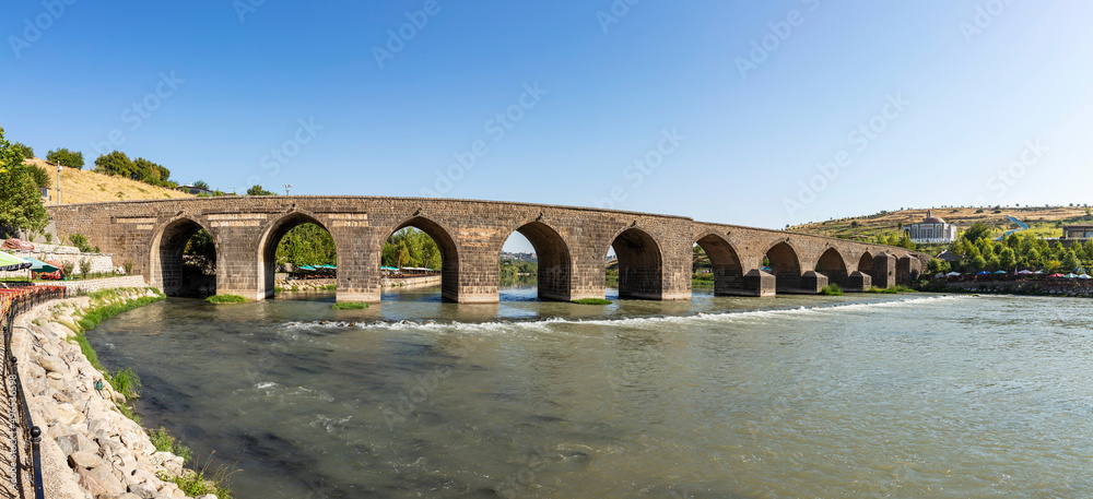 Historical Diyarbakır ten-eyed bridge and reflection of the Tigris river