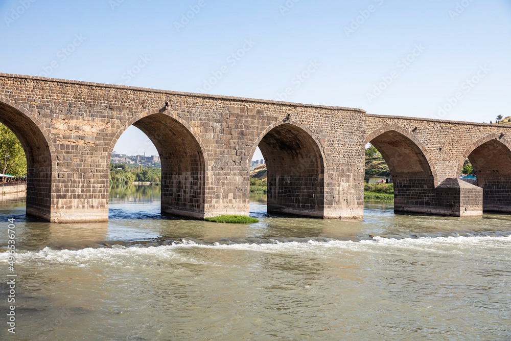 Historical Diyarbakır ten-eyed bridge and reflection of the Tigris river