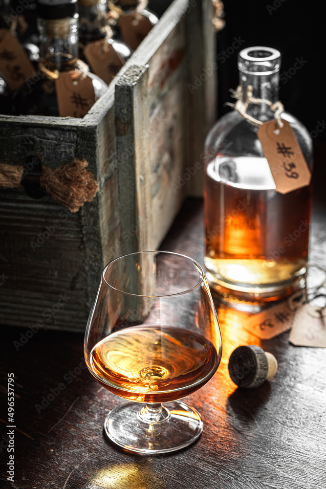 Tasty and noble brendy with ice in an old cellar.