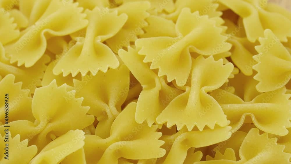 Farfalle - bow shaped pasta loopable background. Farfalle - bow shaped pasta loopable background.