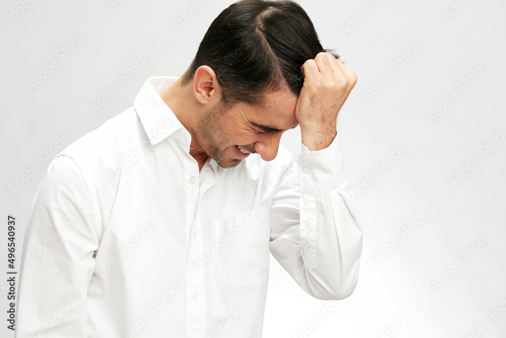 businessman portrait in a white shirt holding on to hair a pensive look self-confidence elegant style businessman portrait in a white shirt holding on to hair a pensive look self-confidence elegant style