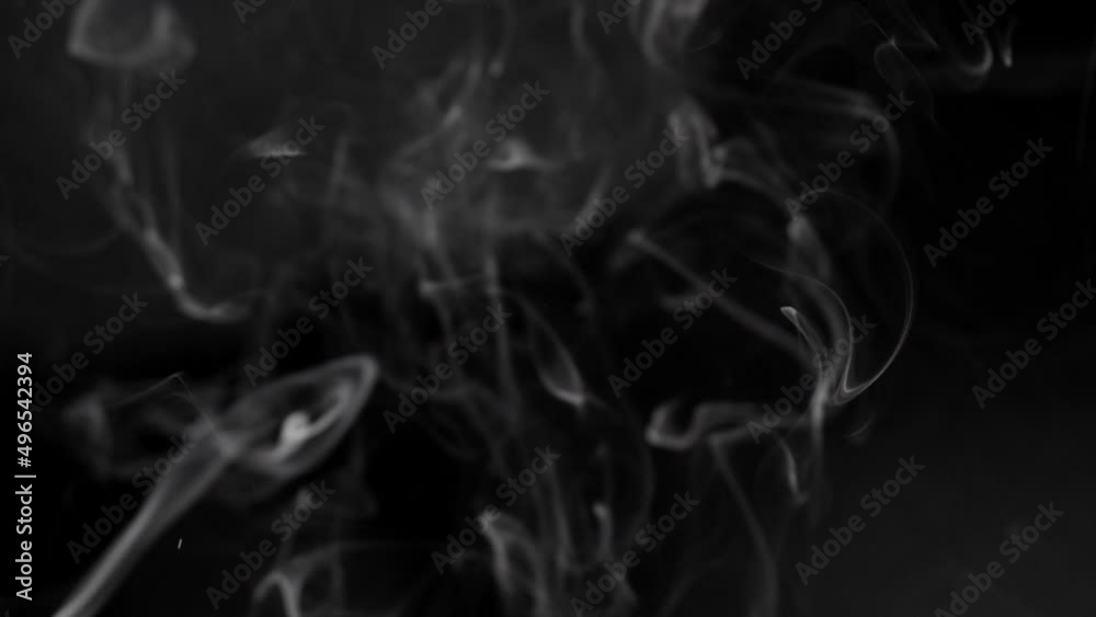 Smoke billowing over a black background.
Smoke on black background in slow motion. Smoke billowing over a black background.
Smoke on black background in slow motion.