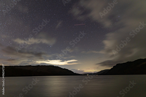 A view of the night sky over Ullswater in the English Lkae District on a cloudy winters night. photo
