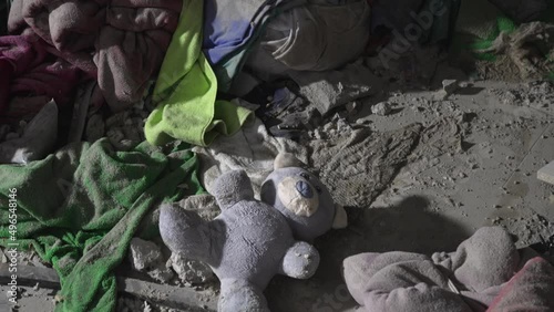 Terror attack bomb shell civilian bombed building destroy city war concept explosion. 2022 Russian invasion of Ukraine war child teddy bear toy building ruins city destruction building damage war torn