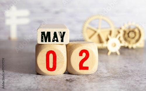 May 2nd. Image of may 2 wooden color calendar on white background. Spring day, empty space for text.