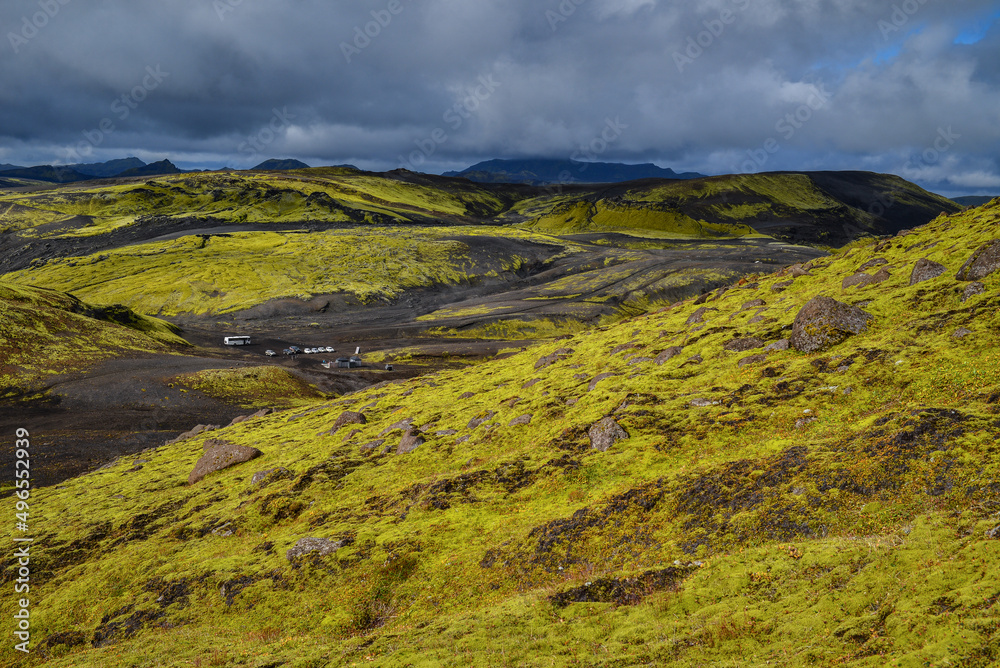Distant view of a parking lot and picnic area as seen from the climb to the summit of Laki volcano, Lakagígar crater row, Vatnajökull National Park, Central Highlands, Iceland Distant view of a parking lot and picnic area as seen from the climb to the summit of Laki volcano, Lakagígar crater row, Vatnajökull National Park, Central Highlands, Iceland