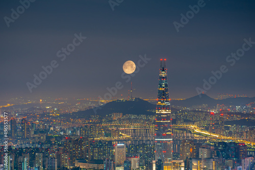 Aerial landscape of Seoul, South Korea at night with full moon