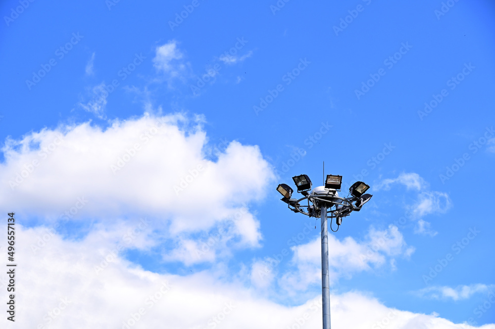 Street lamps post with energy-saving technology, cloud on blue sky background, Thailand.