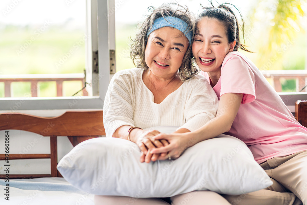 Obraz premium Portrait of enjoy happy love asian family senior mature mother and young woman daughter smiling laughing embracing and having fun hug together.happy family in moments good time at home