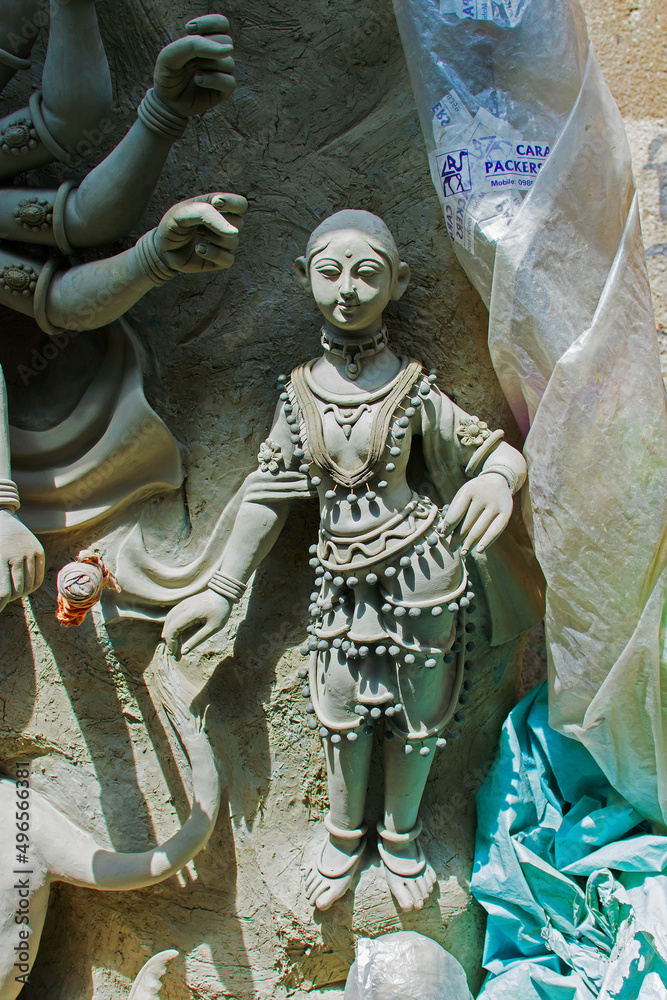 Fototapeta premium KOLKATA, WEST BENGAL, INDIA - 25 SEPTEMBER 2016: Clay idol of Goddess Durga, under preparation for 