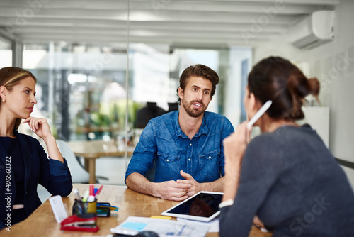 Putting ideas on the table. Shot of a group of businesspeople having a meeting together in an office.