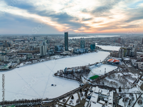 Yekaterinburg aerial panoramic view in Winter at sunset. Yekaterinburg city and pond in winter.