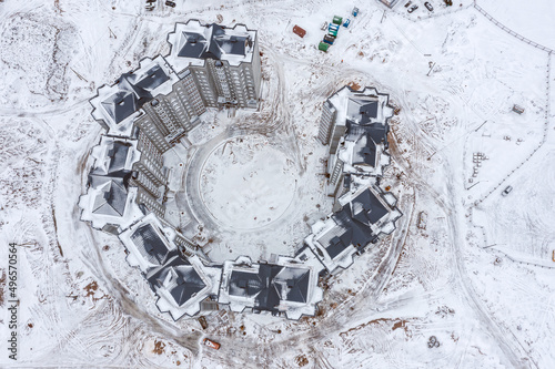 newly constructed high-rise apartment buildings in city residential area. aerial view in wintertime.