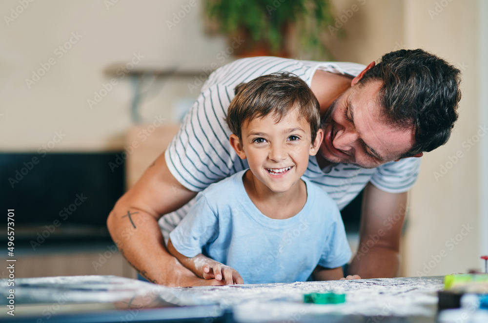 Were making cookies today. Shot of an adorable little boy baking with his father at home. Were making cookies today. Shot of an adorable little boy baking with his father at home.