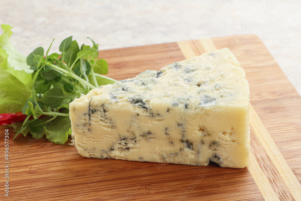 Blue cheese piece over board
