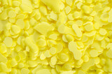 Pile of yellow sulfur granules used in medicine, fertilizers. Yellow sulfur background, texture, top view. Heap of sulfur powder, background, texture, top view.