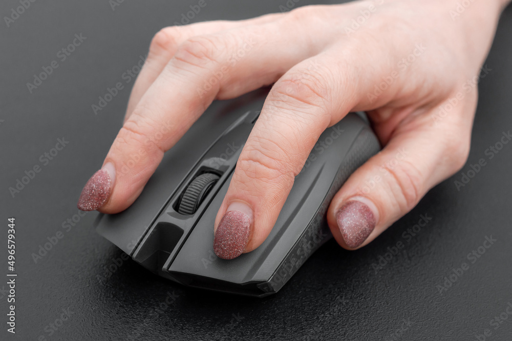Hand holding computer mouse. Close up. Hand holding computer mouse. Close up.