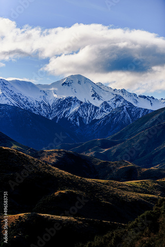 Snow covered peaks in mountain landscape