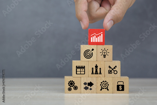 Hand choose graph on business strategy plan icon concept of financial research for management to success and growth.