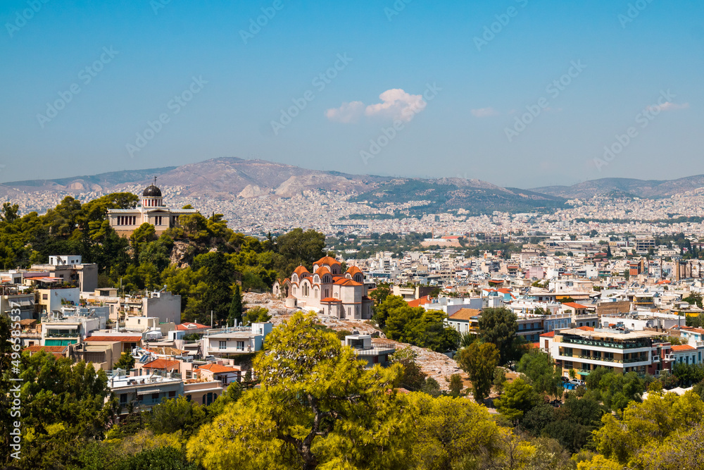 Panoramic view on Athens from Acropolis with the Church of Saint Marina in Thissio and National Observatory of Athens