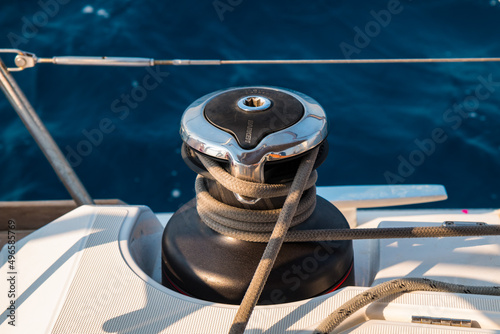 Winch on a sailing yacht with a rope coiled on it