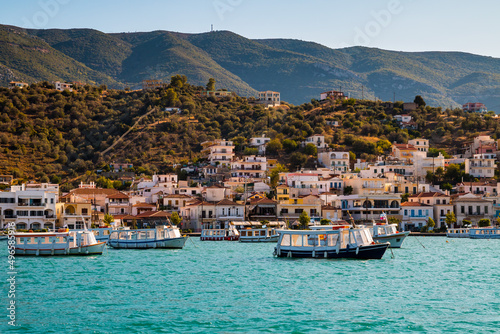 View on many boots and vintage buildings in Galatas, Greece, from the water (Stenon Porou) near half island Poros