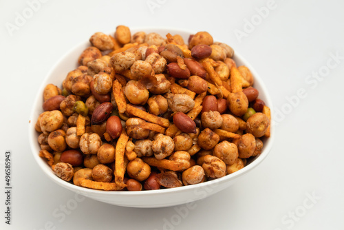 Cocktail Mix Namkeen Mixture Also Called Tedhe Medhe Chakhna Made Of Mixed Nuts Like Kabuli Chana Mungfali Hara Matar Kabli Channa And Moongfali Badam. Isolated On White Background With Copy Space