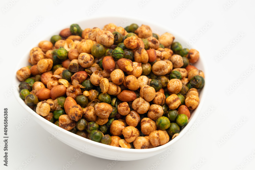 Cocktail Mix Namkeen Mixture Also Called Tedhe Medhe Chakhna Made Of Mixed Nuts Like Kabuli Chana Mungfali Hara Matar Kabli Channa And Moongfali Badam. Isolated On White Background With Copy Space Cocktail Mix Namkeen Mixture Also Called Tedhe Medhe Chakhna Made Of Mixed Nuts Like Kabuli Chana Mungfali Hara Matar Kabli Channa And Moongfali Badam. Isolated On White Background With Copy Space