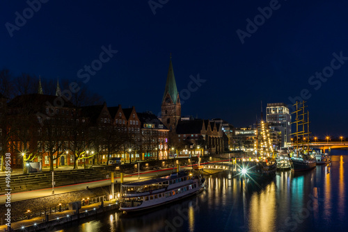 Night view of Bremen with the buildings  bridges and ships reflecting in the river